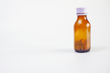 brown glass bottle for supplement product isolated on white background with clipping path