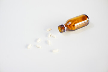 brown glass bottle for supplement product isolated on white background with clipping path