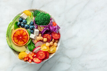Buddha Bowl. Rainbow salad. Vegan poke bowl with avocado. Healthy food. Overhead flat lay shot with copy space