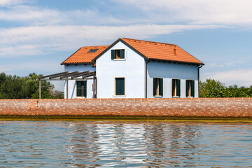 A light blue house overlooking the Venetian Lagoon, Venice, Veneto, Italy