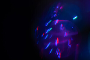 Blurred Light painting one exposure in camera. light glares with a spectral gradient on a dark...