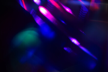 Blurred Light painting one exposure in camera. light glares with a spectral gradient on a dark...