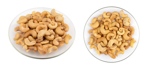 roasted salted cashew nuts on the plate on white