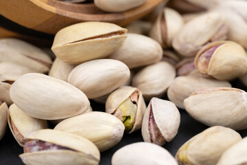 Roasted and Salted Pistachios in a Bowl on a gray background