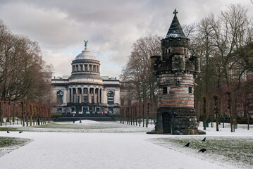 Folly in Cinquantenaire parc in Brussels during the winter with the Art & History Museum in the background
