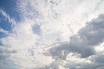 Real majestic bright blue sky with scattered white multilayer clouds on sunny day. Sky view. Skyscape. Peaceful cloudscape with altostratus and cumulus clouds background 