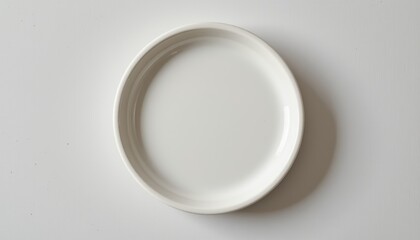 Minimalist photography, a study of light and shadow on simple white plate on white surface