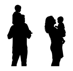 Silhouette of a father carrying a baby and mother holding a baby