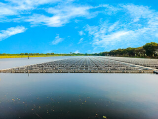 Floating solar farm on a lake. Renewable energy, sustainability, power generation