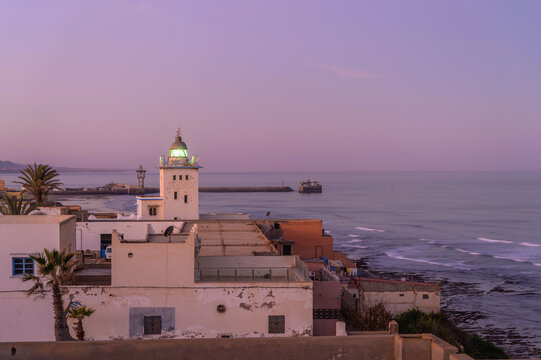 Sidi Ifni light tower illuminating the Moroccan coastline at dusk