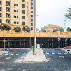Urban Intersection with Metro Station Background, Showcasing City Life and Transportation.