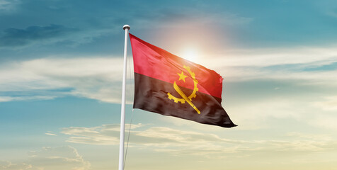 Angola national flag waving in the sky with mast. 