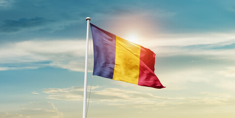 Chad national flag waving in the sky with mast. 