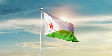 Djibouti national flag waving in the sky with mast.