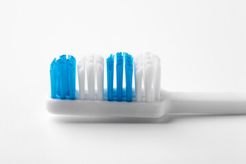 Blue toothbrush on a white background. Close up