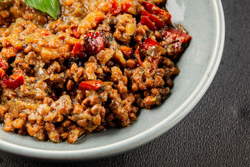 Lentil dish vegetables and roasted peppers savory vegetable fresh vegetarian and vegan food gourmet food background on the table rustic food top view copy space keto and paleo diet