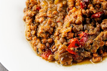 Lentil dish vegetables and roasted peppers savory vegetable fresh vegetarian and vegan food gourmet food background on the table rustic food top view copy space keto and paleo diet