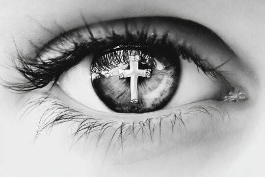 Eye reflection with glowing cross	