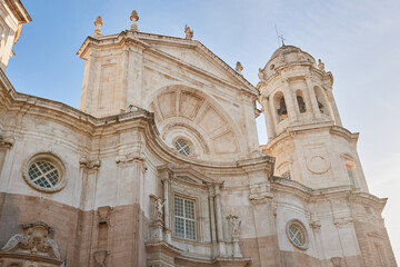 Obraz premium Baroque and neoclassical facade of the Cathedral of Cadiz, Spain, under morning light