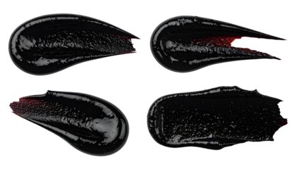 collection of four elongated black garlic sauce smears with glossy texture for gourmet food decoration on isolated background
