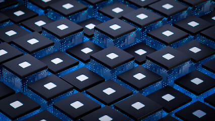 A row of futuristic computer chips emanating eye-catching blue light for chip as well as AI scenarios