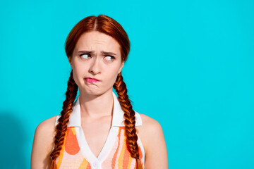 Photo of pretty young woman look empty space wear dress isolated on teal color background