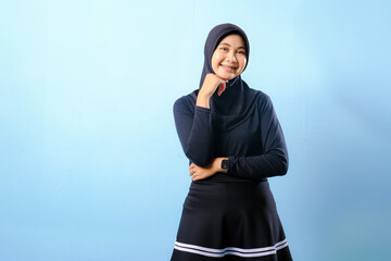A woman wearing a black skirt and a black head scarf