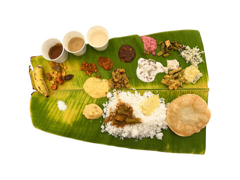 Traditional South Indian Sadhya Meal Served on a Banana Leaf &ndash; Top View of Kerala Vegetarian Feast