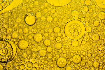 Macro close up yellow oil bubble texture,Gold Oil bubbles close up. circles of orange water macro....