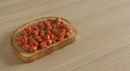 Toast with tomato spread and herbs on wooden table
