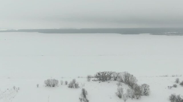 Aerial Drone Shot of Old Soviet Truck Driving Through Snowy Rural Landscape in Harsh Russian Winter