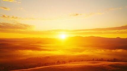 Sunrise over misty mountains