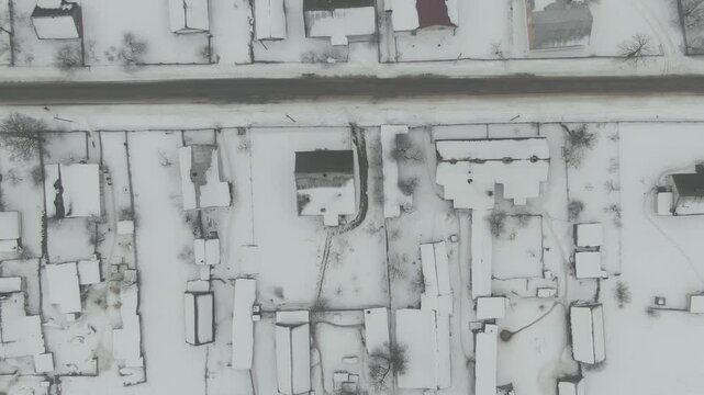 Aerial Drone Shot of Old Soviet Truck Driving Through Snowy Rural Landscape in Harsh Russian Winter