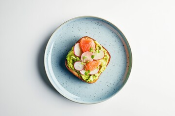 Gourmet open sandwich with avocado, salmon, radish, and greens served on a blue plate. Ideal for restaurant menus, healthy food blogs, catering ads, or modern culinary presentations. Copy space