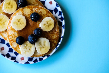 Fresh Pancakes With Sliced Banana Blueberries And Honey