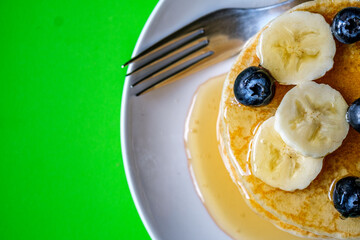 Fresh Pancakes With Sliced Banana Blueberries And Honey
