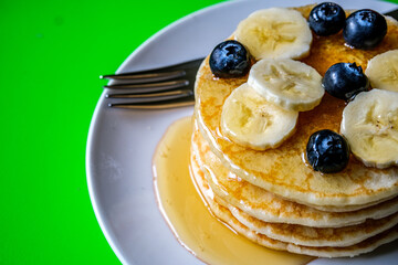 Fresh Pancakes With Sliced Banana Blueberries And Honey