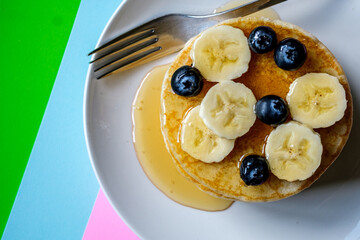 Fresh Pancakes With Sliced Banana Blueberries And Honey