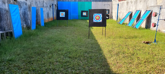 outdoor archery area with multiple archery targets
