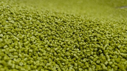 Pile of Green Plastic Pellets, Raw Material, Polymer, Manufacturing, Industrial, Texture