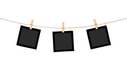 blank instant photos hanging on clothesline