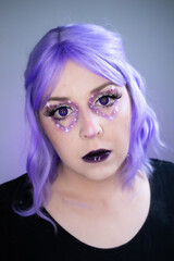 Valentine's Day fantasy makeup with a galactic twist. Purple wig, violet eyes, and starry eye makeup create a dreamy, cosmic lover vibe.