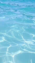 Obraz premium Light blue water with ripples and waves background