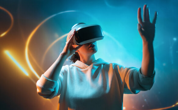 Woman with VR virtual reality goggles
