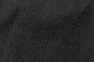 Textured black fabric background for design and artistic applications