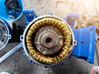 The internal components of an electric motor stator windings and  rotor shaft bearing in...