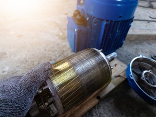 Checking the iron rotor on the electric motor, there are traces of friction due to unstable...