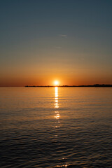 Fototapeta premium sunset in beautiful colours over lake constance seen from Bregenz towards the island of Lindau