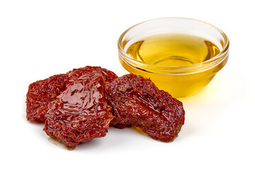 Sun-dried tomatoes with olive oil, isolated on white background.