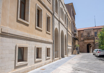 Chania old town architecture. Crete, Greece. Neoclassical building and aged stone building, cobblestone street